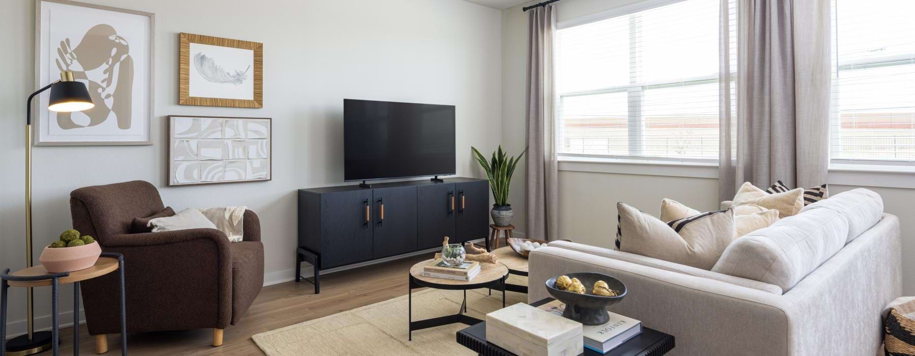 a living room with a tv and couches