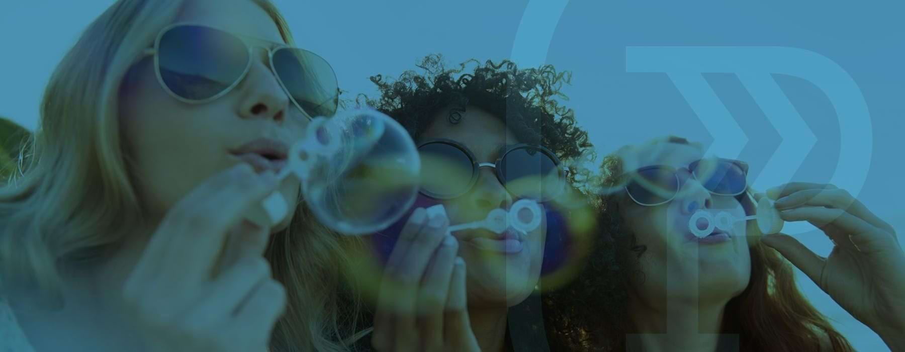 a group of people wearing glasses and holding up bubbles