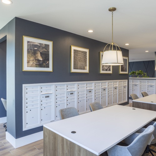 a large living room with a large table and a large tv