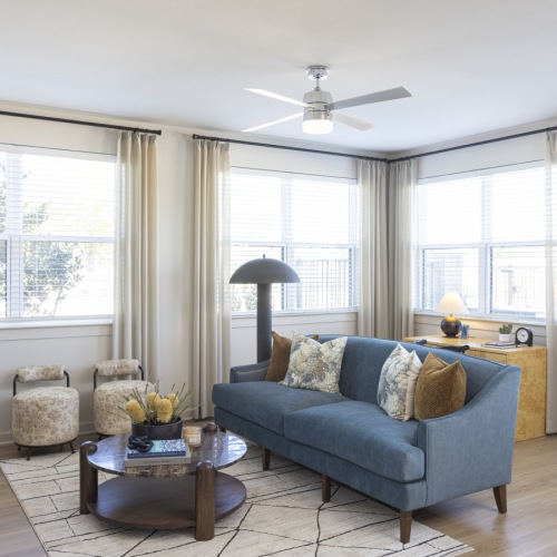 living room with ceiling fan 