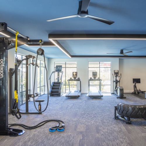a large room with a table and chairs